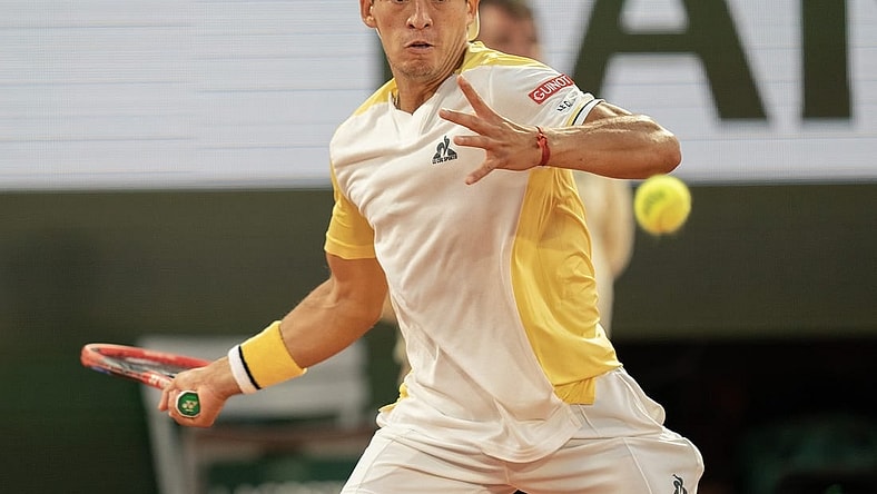 May 30, 2023; Paris,France; Sebastian Baez (ARG) returns a shot during his match against Gael Monfils (FRA) on day three at Stade Roland-Garros. Mandatory Credit: Susan Mullane-USA TODAY Sports