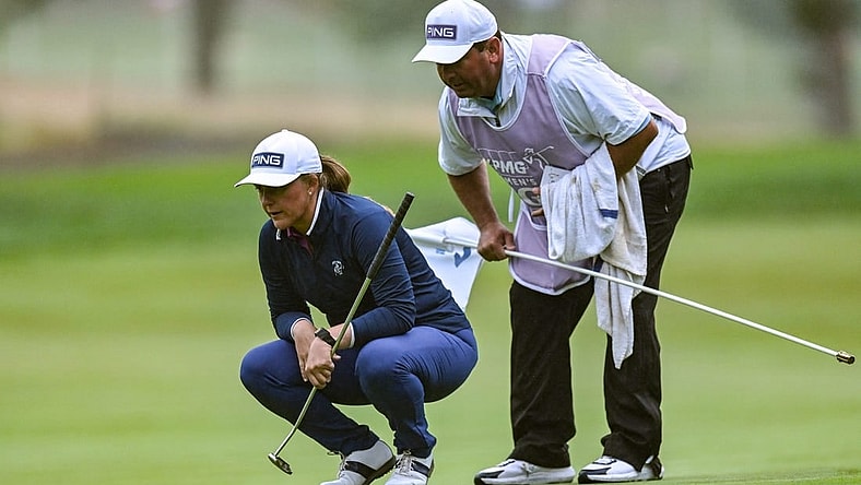 Jun 22, 2023; Springfield, New Jersey, USA; Marissa Steen and her caddie line up a putt on the 1st green during the first round of the KPMG Women's PGA Championship golf tournament. Mandatory Credit: John Jones-USA TODAY Sports