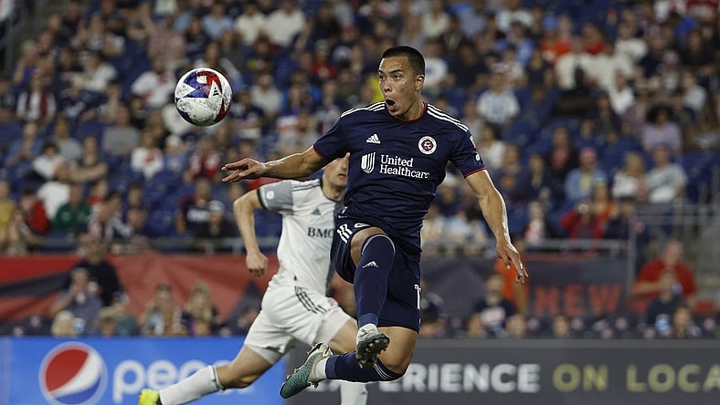 Jun 24, 2023; Foxborough, Massachusetts, USA; New England Revolution forward Bobby Wood (17) goes up to control the ball against the Toronto FC during the second half at Gillette Stadium. Mandatory Credit: Winslow Townson-USA TODAY Sports