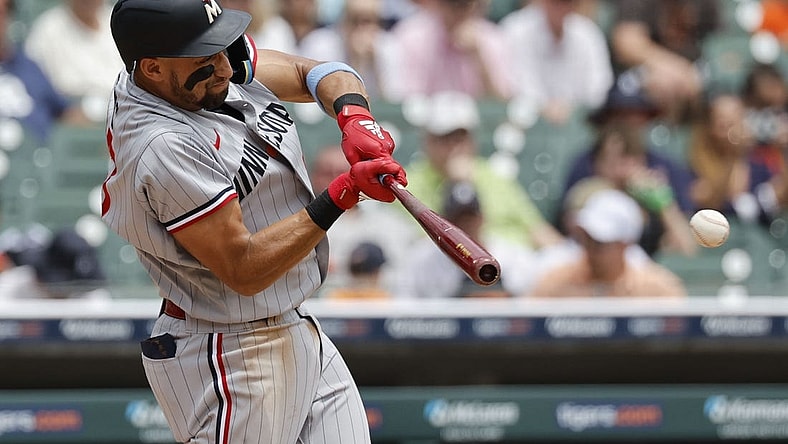 Jun 25, 2023; Detroit, Michigan, USA; Minnesota Twins third baseman Royce Lewis (23) hits a single in the sixth inning against the Detroit Tigers at Comerica Park. Mandatory Credit: Rick Osentoski-USA TODAY Sports