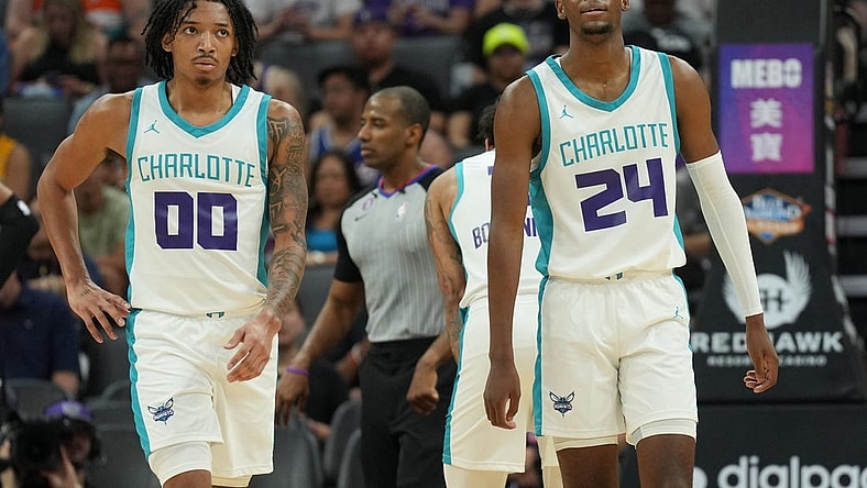Jul 3, 2023; Sacramento, CA, USA; Charlotte Hornets guard Nick Smith Jr. (00) and forward Brandon Miller (24) walk on the court during the third quarter at Golden 1 Center. Mandatory Credit: Darren Yamashita-USA TODAY Sports