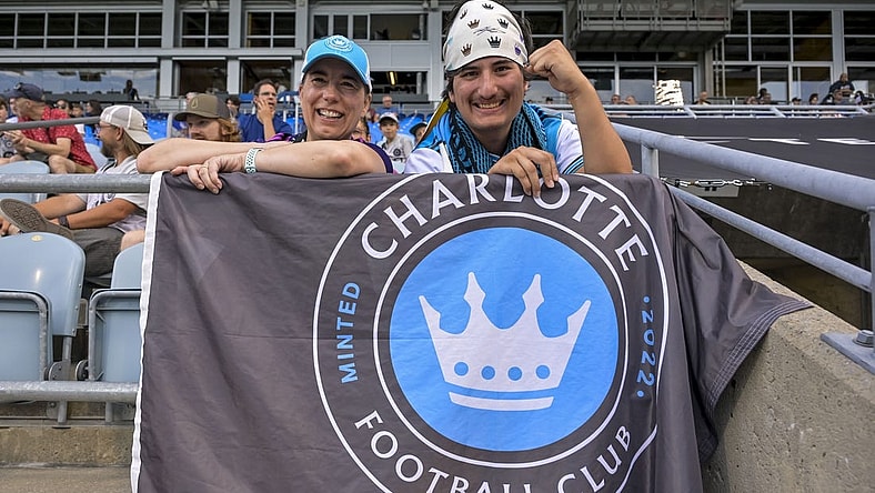 Jul 15, 2023; Montreal, Quebec, CAN; Charlotte FC fans Audrey and Lisa cheer on their team before the match between Charlotte FC and CF Montreal at Stade Saputo. Mandatory Credit: Eric Bolte-USA TODAY Sports