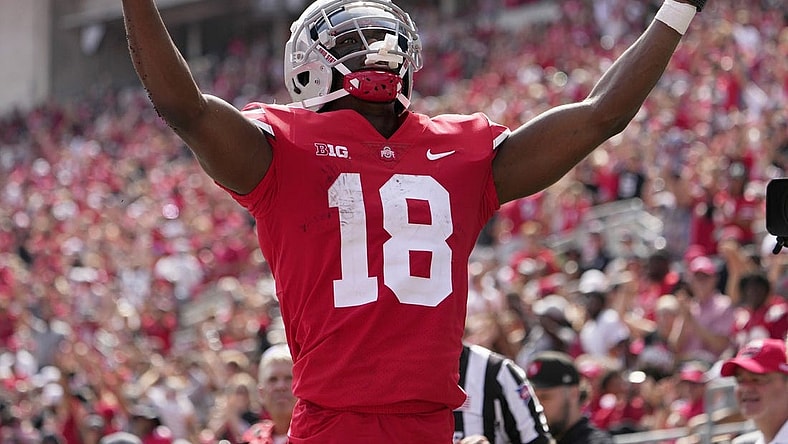 September 10, 2022; Columbus, Ohio, USA; Ohio State Buckeyes wide receiver Marvin Harrison Jr. (18) celebrates after scoring a touchdown during the second half of Saturday's game against the Arkansas State Red Wolves at Ohio Stadium.Mandatory Credit: Barbara J. Perenic/Columbus Dispatch