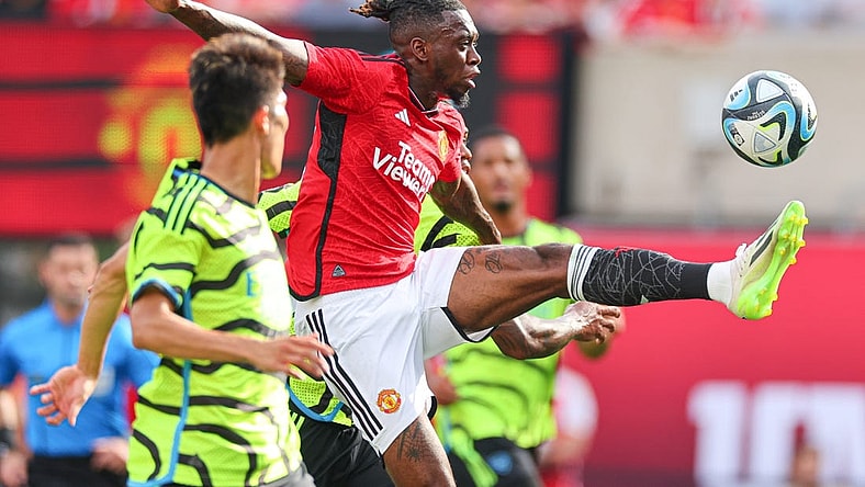 Jul 22, 2023; East Rutherford, New Jersey, USA; Manchester United defender Aaron Wan-Bissaka (29) plays the ball in front of Arsenal midfielder Declan Rose (41) during the first half at MetLife Stadium. Mandatory Credit: Vincent Carchietta-USA TODAY Sports