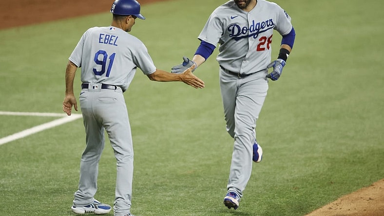 Jul 22, 2023; Arlington, Texas, USA; Los Angeles Dodgers designated hitter J.D. Martinez (28) is congratulated by third base coach Dino Ebel (91) after hitting a three-run home run against the Texas Rangers in the fourth inning at Globe Life Field. Mandatory Credit: Tim Heitman-USA TODAY Sports