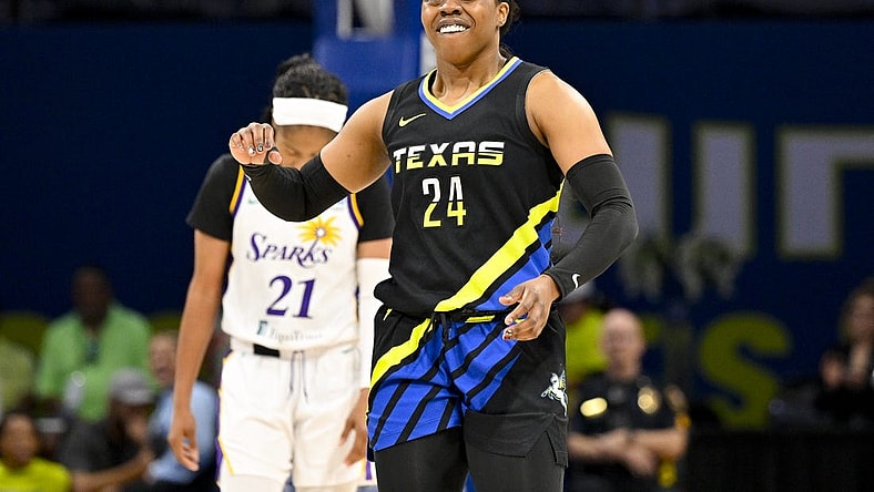 Jul 22, 2023; Arlington, Texas, USA; Dallas Wings guard Arike Ogunbowale (24) celebrates during the second half against the Los Angeles Sparks at College Park Center. Mandatory Credit: Jerome Miron-USA TODAY Sports