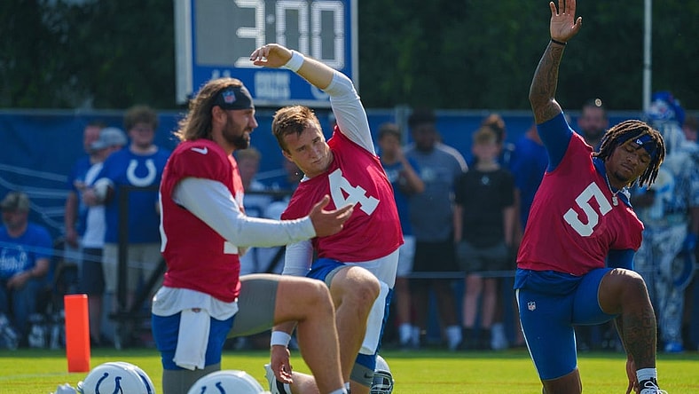 Indianapolis Colts quarterbacks Gardner Minshew (10), Sam Ehlinger (4), and Anthony Richardson (5) stretch before the first day of training camp practice Wednesday, July 26, 2023, at Grand Park Sports Complex in Westfield, Indiana.