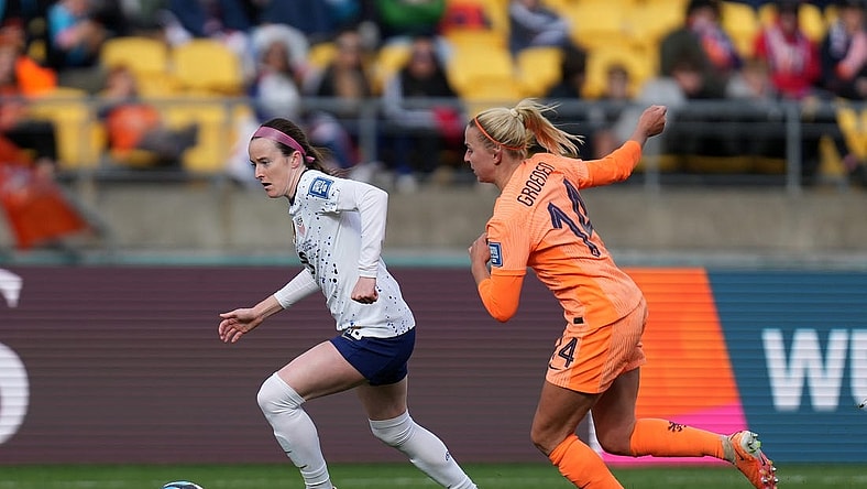 Jul 27, 2023; Wellington, NZL; United States midfielder Rose Lavelle (16) kicks the ball past Netherlands midfielder Jackie Groenen (14) during the second half in a group stage match for the 2023 FIFA Women's World Cup at Wellington Regional Stadium. Mandatory Credit: Jenna Watson-USA TODAY Sports