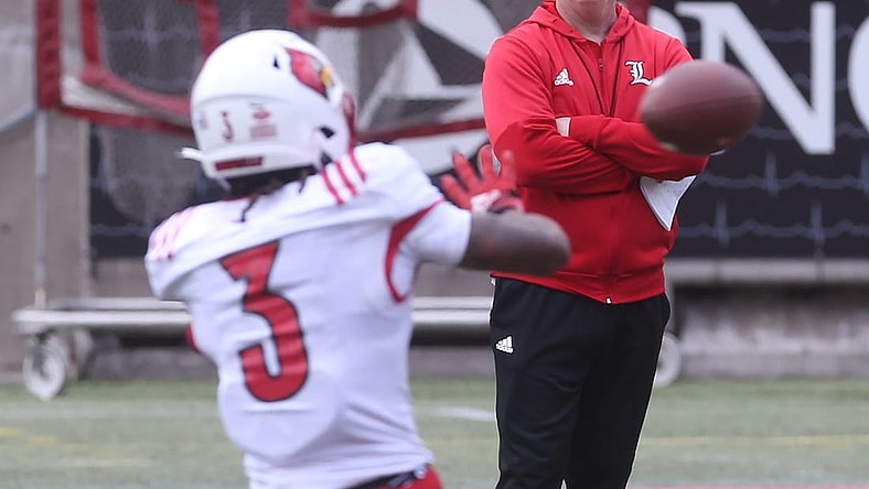 Louisville   s coach Jeff Brohm watches Kevin Coleman catch the ball on April 14, 2023 during the Cardinals' final open practice before their spring game.
