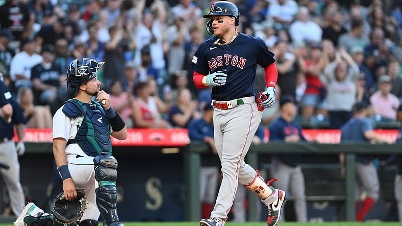 Aug 1, 2023; Seattle, Washington, USA; Boston Red Sox designated hitter Alex Verdugo (99) crosses home plate after hitting a two run home run against the Seattle Mariners during the fifth inning at T-Mobile Park. Mandatory Credit: Steven Bisig-USA TODAY Sports