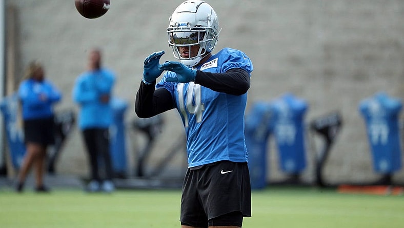 Lions wide receiver Amon-Ra St. Brown catches passes during training camp on Wednesday, Aug. 02, 2023, in Allen Park.