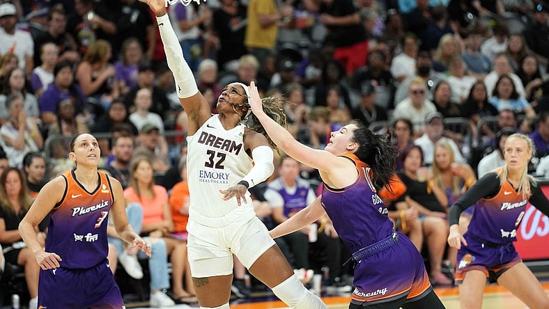 Aug 3, 2023; Phoenix, Arizona, USA; Atlanta Dream forward Cheyenne Parker (32) puts up a layup against Phoenix Mercury center Megan Gustafson (10) during the second half at Footprint Center. Mandatory Credit: Joe Camporeale-USA TODAY Sports