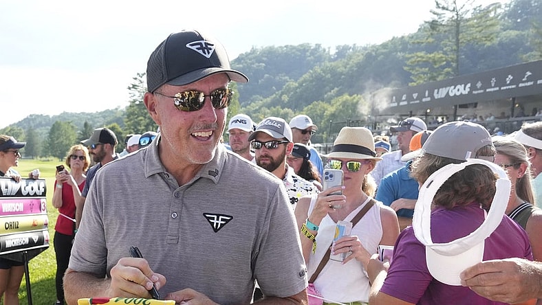 Aug 4, 2023; White Sulphur Springs, West Virginia, USA; Phil Mickelson signs autographs after the first round of the LIV Golf event at The Old White Course. Mandatory Credit: Bob Donnan-USA TODAY Sports