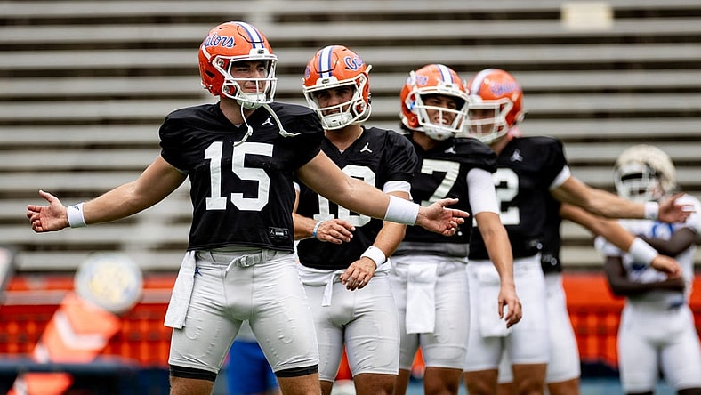 Florida Gators quarterback Graham Mertz (15) stretches with Florida Gators quarterback Jack Miller III (10) and Florida Gators quarterback Max Brown (17) during fall football practice at Ben Hill Griffin Stadium at the University of Florida in Gainesville, FL on Saturday, August 5, 2023. [Matt Pendleton/Gainesville Sun]