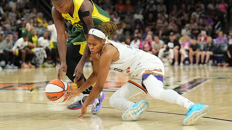 Aug 5, 2023; Phoenix, Arizona, USA; Seattle Storm guard Jewell Loyd (24) and Phoenix Mercury guard Moriah Jefferson (8) go after a loose ball during the second half at Footprint Center. Mandatory Credit: Joe Camporeale-USA TODAY Sports