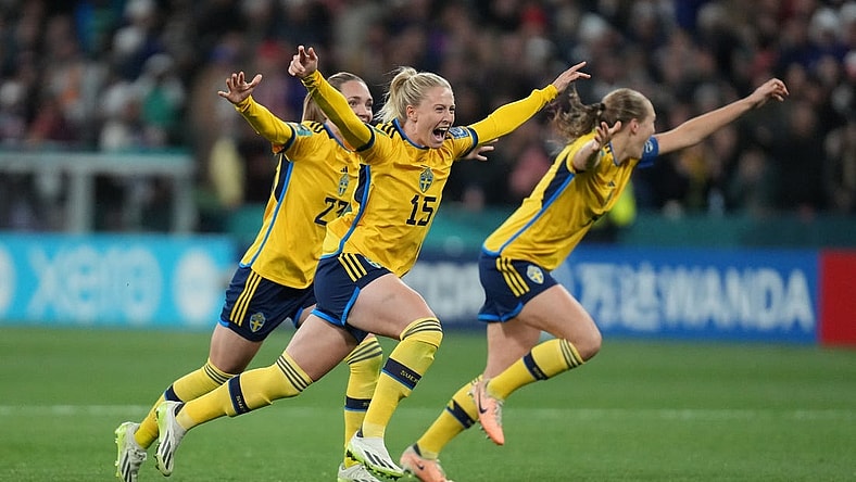 Aug 6, 2023; Melbourne, AUS; Sweden forward Rebecka Blomqvist (15), midfielder Elin Rubensson (23) and defender Magdalena Eriksson (6) celebrate after forward Lina Hurtig (not pictured) scored the winning goal against the United States in the penalty kick shootout during a Round of 16 match in the 2023 FIFA Women's World Cup at Melbourne Rectangular Stadium. Mandatory Credit: Jenna Watson-USA TODAY Sports