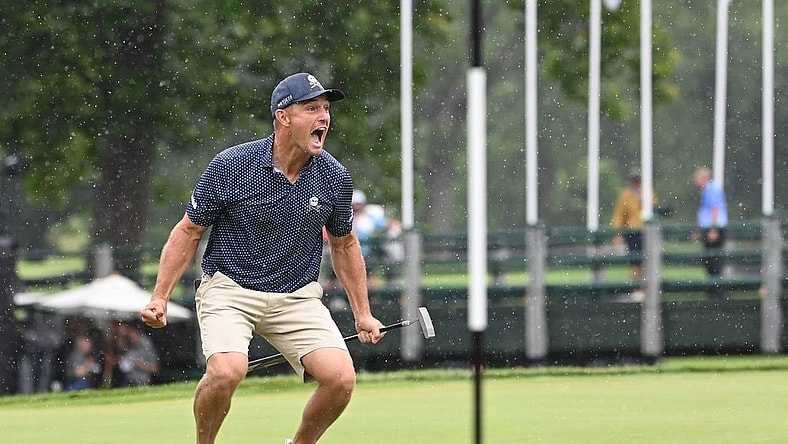 Aug 6, 2023; White Sulphur Springs, West Virginia, USA; Bryson DeChambeau celebrates after hitting a birdie putt on 18 and shooting a record 58 during the final round of the LIV Golf event at The Old White Course. Mandatory Credit: Bob Donnan-USA TODAY Sports