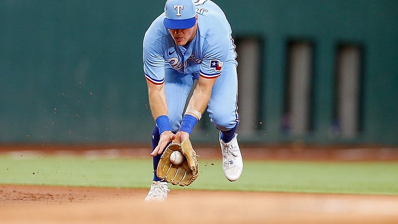 Aug 6, 2023; Arlington, Texas, USA; Texas Rangers third baseman Josh Jung (6) fields a ground ball during the first inning against the Miami Marlins at Globe Life Field. Mandatory Credit: Andrew Dieb-USA TODAY Sports