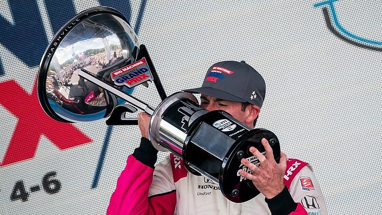 NTT IndyCar Series driver Kyle Kirkwood celebrates winning the Music City Grand Prix in Nashville, Tenn., Sunday, Aug. 6, 2023.