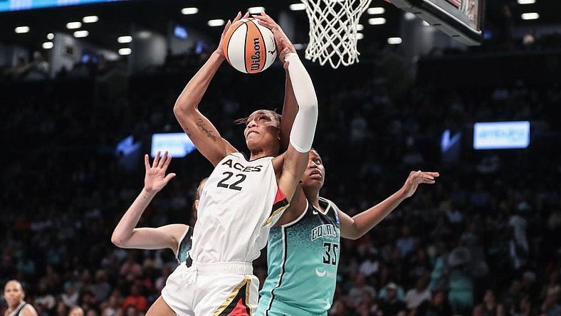 Aug 6, 2023; Brooklyn, New York, USA; Las Vegas Aces forward A'ja Wilson (22) grabs a rebound in front of New York Liberty forward Jonquel Jones (35) in the third quarter at Barclays Center. Mandatory Credit: Wendell Cruz-USA TODAY Sports