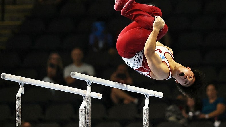 Aug 6, 2023; Hoffman Estates, Illinois, USA; Asher Hong performs on the parallel bars during the Core Hydration Classic at NOW Arena. Mandatory Credit: Jon Durr-USA TODAY Sports