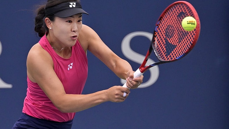 Aug 7, 2023; Montreal, Quebec, Canada; Lin Zhu (CHN) hits a backhand against Karolina Pliskova (CZE) in first round play at IGA Stadium. Mandatory Credit: Eric Bolte-USA TODAY Sports