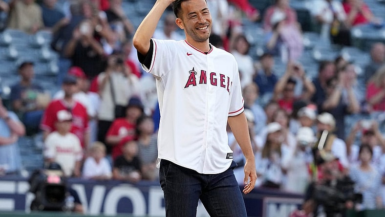 Aug 8, 2023; Anaheim, California, USA; LA Galaxy defender Maya Yoshida gestures after throwing the ceremonial first pitch before the game between the Los Angeles Angels and the San Francisco Giants at Angel Stadium. Mandatory Credit: Kirby Lee-USA TODAY Sports