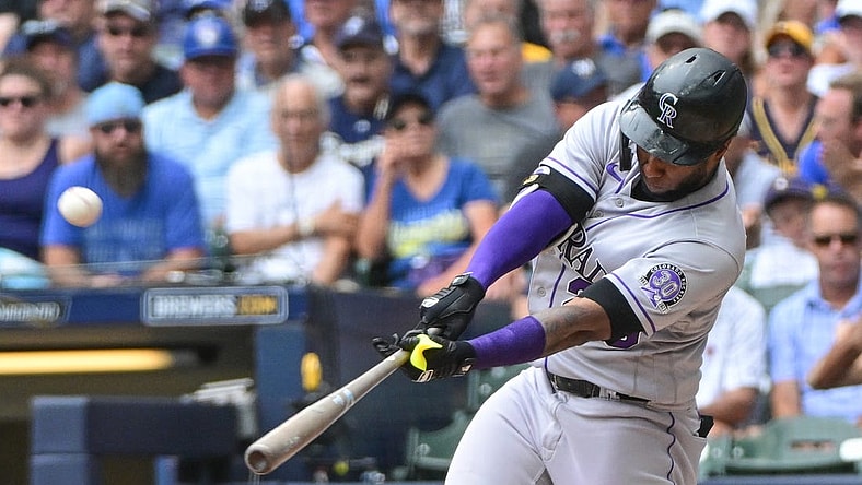 Aug 9, 2023; Milwaukee, Wisconsin, USA; Colorado Rockies designated hitter Jurickson Profar (29) hits a solo home run against the Milwaukee Brewers in the fourth inning at American Family Field. Mandatory Credit: Benny Sieu-USA TODAY Sports
