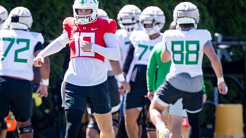 Oregon quarterback Bo Nix works out with the Ducks during practice Wednesday, Aug. 9, 2023 in Eugene.