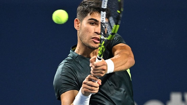 Aug 10, 2023; Toronto, Ontario, Canada;  Carlos Alcaraz (ESP) plays a shot against Hubert Hurkacz (POL) (not pictured) in third round play at Sobeys Stadium. Mandatory Credit: Dan Hamilton-USA TODAY Sports