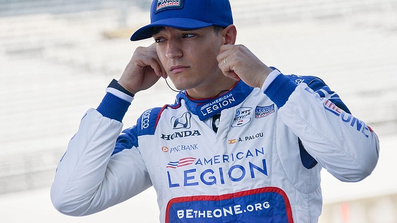 Chip Ganassi Racing driver Alex Palou (10) puts in his hearing protection Friday, Aug. 11, 2023, during practice for the Gallagher Grand Prix at Indianapolis Motor Speedway.