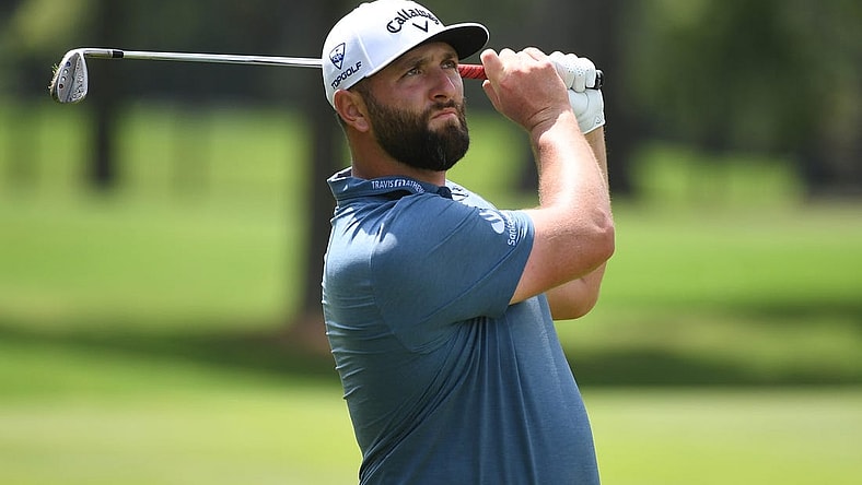 Aug 11, 2023; Memphis, Tennessee, USA; Jon Rahm watches his second shot on the ninth hole during the second round of the FedEx St. Jude Championship golf tournament. Mandatory Credit: Christopher Hanewinckel-USA TODAY Sports