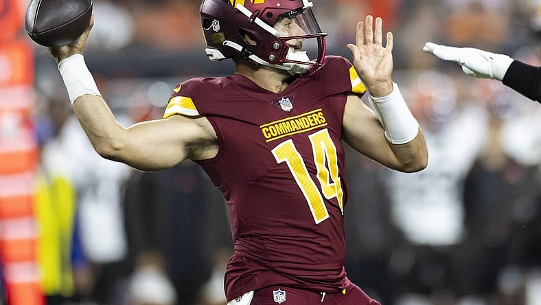 Aug 11, 2023; Cleveland, Ohio, USA; Washington Commanders quarterback Sam Howell (14) throws the ball against the Cleveland Browns during the first quarter at Cleveland Browns Stadium. Mandatory Credit: Scott Galvin-USA TODAY Sports