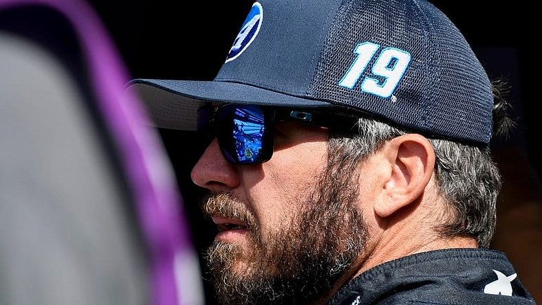 NASCAR Cup Series driver Martin Truex Jr. (19) stands by his car Saturday, Aug. 12, 2023, during practice for the NASCAR Cup Series Verizon 200 at Indianapolis Motor Speedway.
