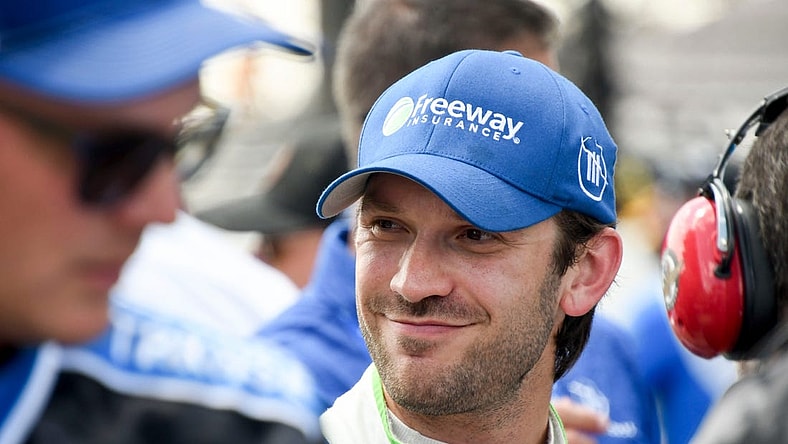 NASCAR Cup Series driver Daniel Suarez (99) smiles after securing pole position Saturday, Aug. 12, 2023, during qualifying for the NASCAR Cup Series Verizon 200 at Indianapolis Motor Speedway.
