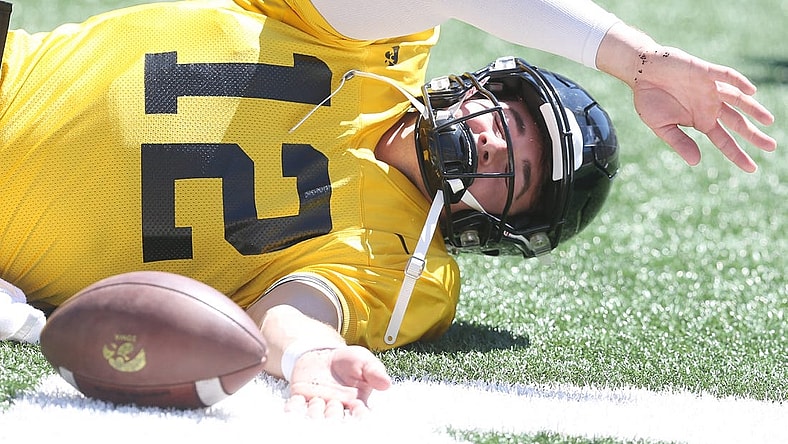 Iowa quarterback Cade McNamara warms up before scrimmaging during Kids' Day at Kinnick at Kinnick Stadium on Saturday, Aug. 12, 2023, in Iowa City, Iowa