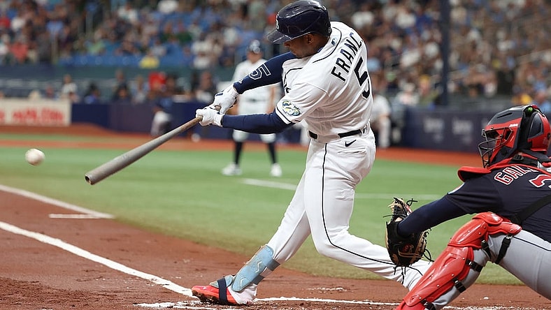 Aug 12, 2023; St. Petersburg, Florida, USA;  Tampa Bay Rays shortstop Wander Franco (5) singles against the Cleveland Guardians during the first inning at Tropicana Field. Mandatory Credit: Kim Klement Neitzel-USA TODAY Sports