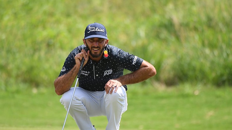 Aug 13, 2023; Memphis, Tennessee, USA; Max Homa lines up a putt on the first hole during the final round of the FedEx St. Jude Championship golf tournament. Mandatory Credit: Christopher Hanewinckel-USA TODAY Sports