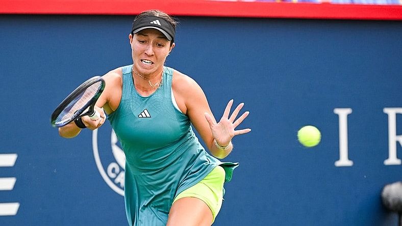 Aug 13, 2023; Montreal, Quebec, Canada; Jessica Pegula (USA) returns the ball against Liudmila Samsonova (not pictured) during singles final play at IGA Stadium. Mandatory Credit: David Kirouac-USA TODAY Sports