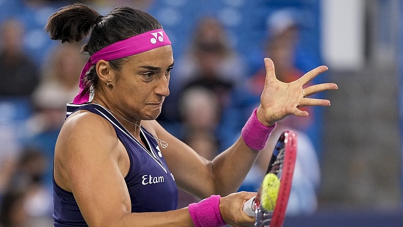 Aug 15, 2023; Mason, OH, USA; Caroline Garcia returns a shot in the first set of a Round of 32 match against Sloane Stephens in the Western & Southern Open at the Lindner Family Tennis Center. Mandatory Credit: Sam Greene-USA TODAY Sports