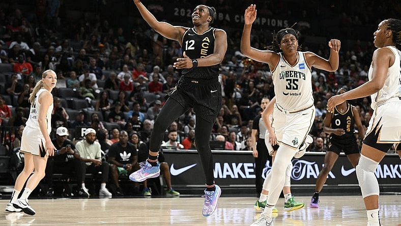 Aug 15, 2023; Las Vegas, Nevada, USA; Las Vegas Aces guard Chelsea Gray (12) drives to the basket against the New York Liberty in the second quarter at Michelob Ultra Arena. Mandatory Credit: Candice Ward-USA TODAY Sports