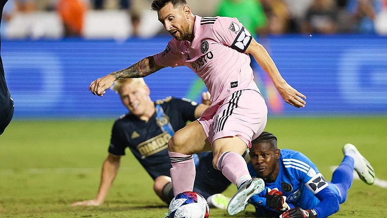 Aug 15, 2023; Chester, PA, USA; Inter Miami forward Lionel Messi (10) shoots the ball against Philadelphia Union goalkeeper Andre Blake (18) in front of defender Jakob Glesnes (5) at Subaru Park. Mandatory Credit: Bill Streicher-USA TODAY Sports