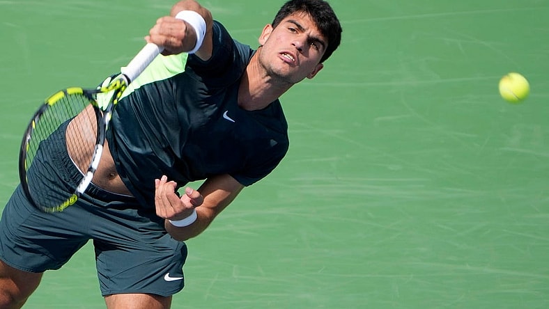 The number one ranked Carlos Alcaraz of Spain, makes a shot to Tommy Paul (14) of the United States on Center Court during the 3rd round of the Western & Southern Open at the Lindner Family Tennis Center in Mason Thursday, August, 17, 2023.