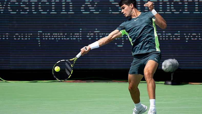 Carlos Alcaraz of Spain, hits a forehand return to Max Purcell of Australia during the quarterfinals of the Western & Southern Open at the Lindner Family Tennis Center in Mason Friday, August, 18, 2023.