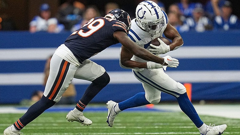 Chicago Bears cornerback Tyrique Stevenson (29) drives Indianapolis Colts running back Kenyan Drake (31) out of bounds with a tackle during the first half of an NFL preseason game Saturday, Aug. 19, 2023, at Lucas Oil Stadium in Indianapolis.