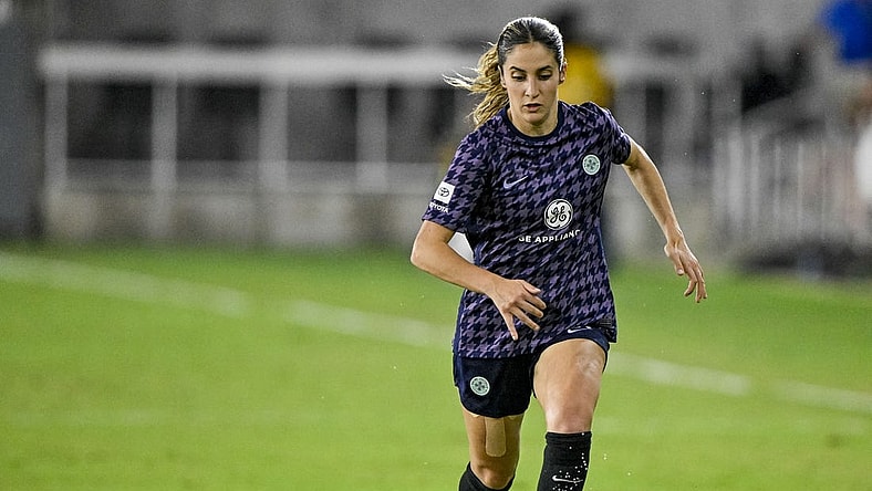 Aug 19, 2023; Louisville, Kentucky, USA; Racing Louisville FC midfielder Savannah DeMelo (7) dribbles the ball during the second half at Lynn Family Stadium. Mandatory Credit: Jamie Rhodes-USA TODAY Sports