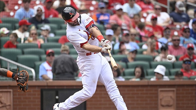 Aug 20, 2023; St. Louis, Missouri, USA; St. Louis Cardinals first baseman Paul Goldschmidt (46) hits an RBI single against the New York Mets in the third inning at Busch Stadium. Mandatory Credit: Joe Puetz-USA TODAY Sports