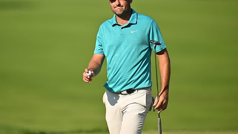Aug 20, 2023; Olympia Fields, Illinois, USA; Scottie Scheffler walks off the 18th green after finishing the final round of the BMW Championship golf tournament. Mandatory Credit: Jamie Sabau-USA TODAY Sports