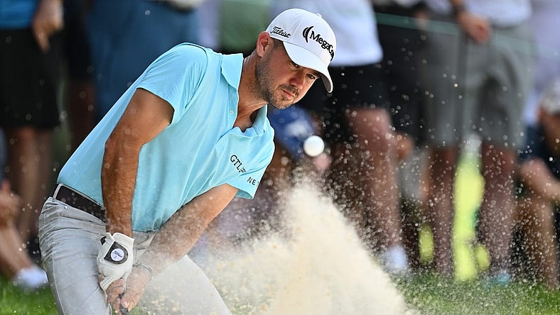 Aug 20, 2023; Olympia Fields, Illinois, USA; Brian Harman hits out of a bunker on the 2nd green during the final round of the BMW Championship golf tournament. Mandatory Credit: Jamie Sabau-USA TODAY Sports