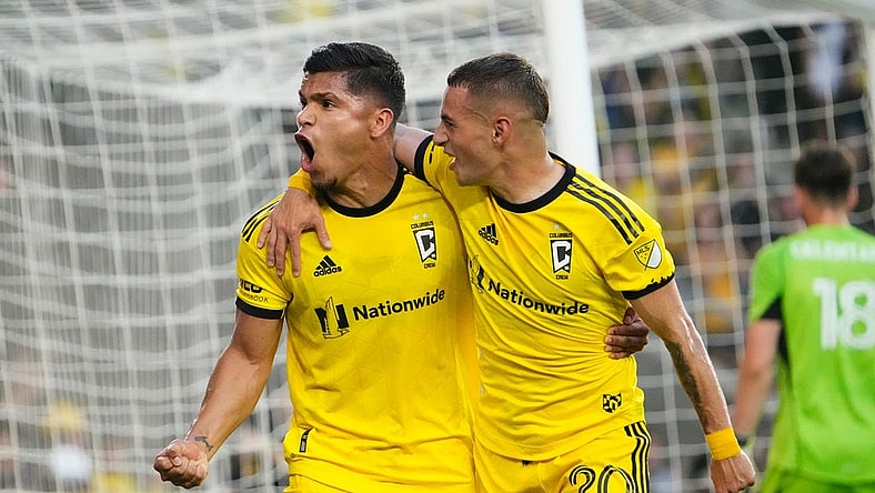 Aug 20, 2023; Columbus, Ohio, USA; Columbus Crew forward Cucho Hernandez (9) celebrates scoring a penalty kick goal with midfielder Alexandru Matan (20) behind FC Cincinnati goalkeeper Roman Celentano (18) during the first half of the MLS soccer match at Lower.com Field.